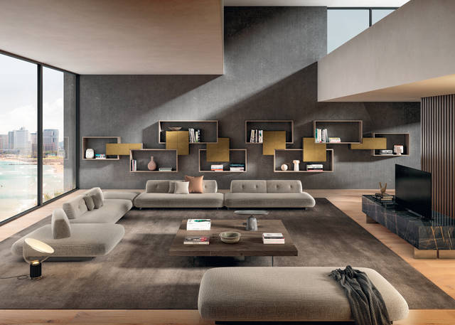 beige sofa with freestanding backrests and wall-mounted bookcase | Sand Sofa | LAGO